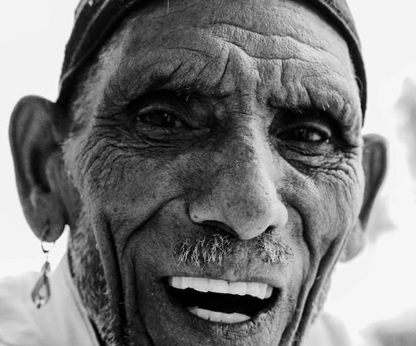 Person feeling energized and refreshed, looking up with a gentle smile.